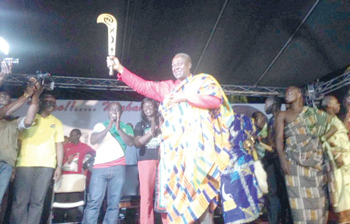  President John Mahama holding the symbolic state sword after it had been presented to him by traditional authorities in New Juaben 